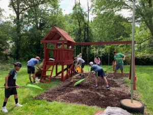 Volunteers assisting an Angels' Arms home