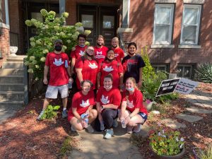 Volunteers doing outside work at an Angels' Arms home